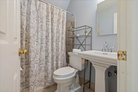 a view of a patio with a table and chairs