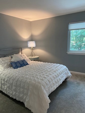 10 Beal's Cove Road, Unit E Hingham, MA 02043 - Photo 7 of 12 a bedroom with a bed and window
