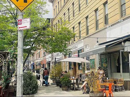 a front view of a building with street view