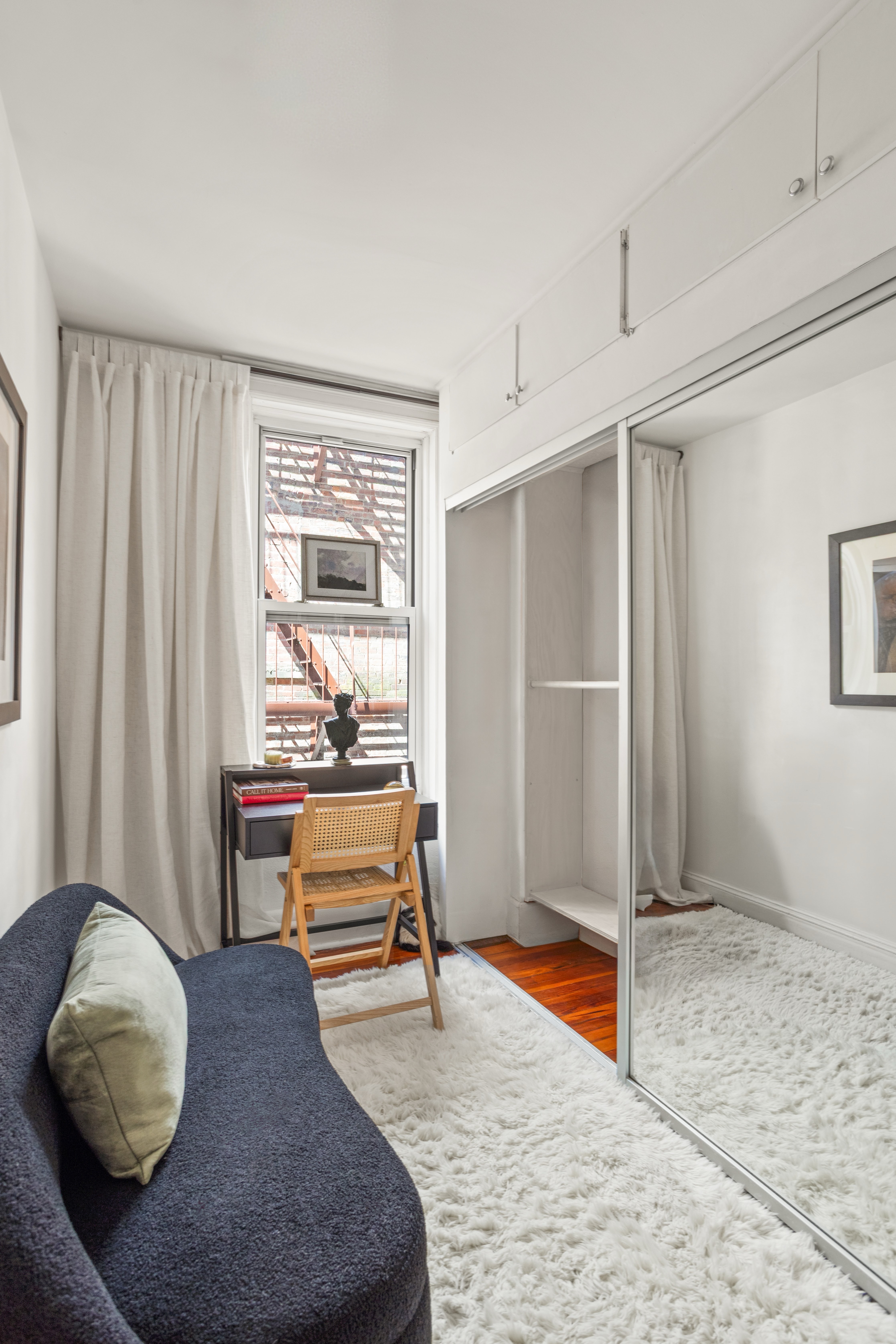 210 East 17th Street, Unit 5C Manhattan, NY 10003 - Photo 4 of 18 a bedroom with furniture and a window