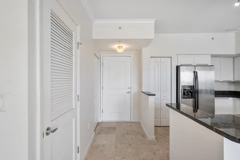 a view of a kitchen with a refrigerator and an oven