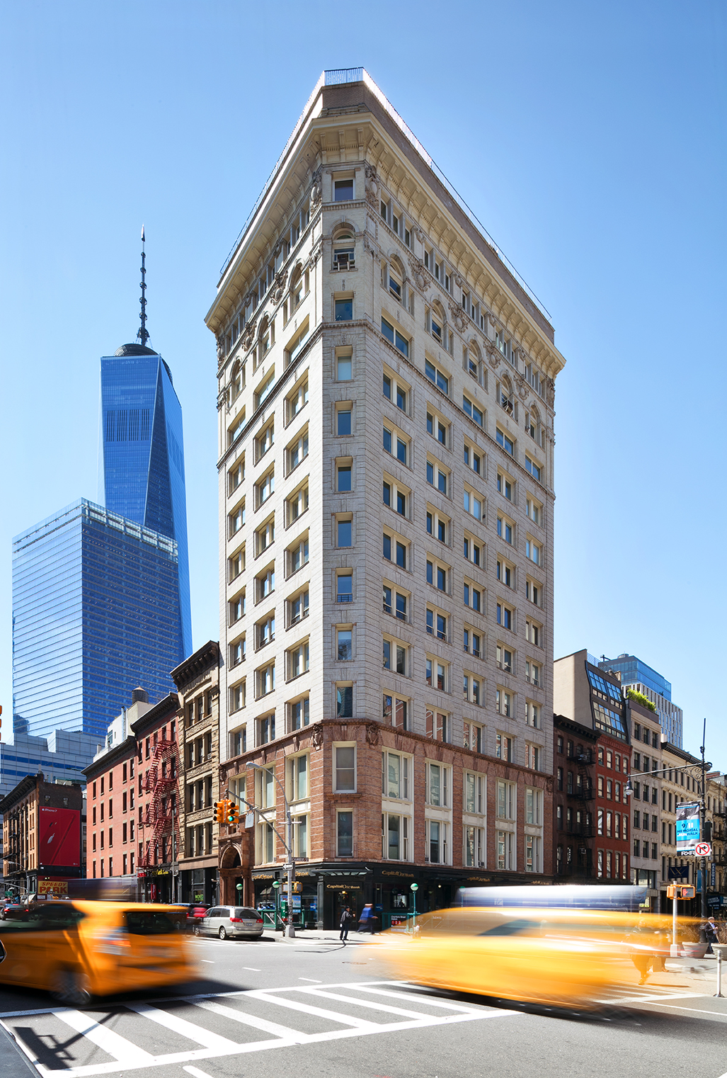 90 West Broadway, Unit 2B Manhattan, NY 10007 - Photo 11 of 12 a view of a tall building next to a road