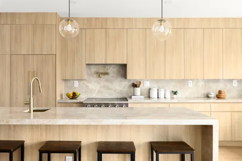 a kitchen with a table and chairs in it