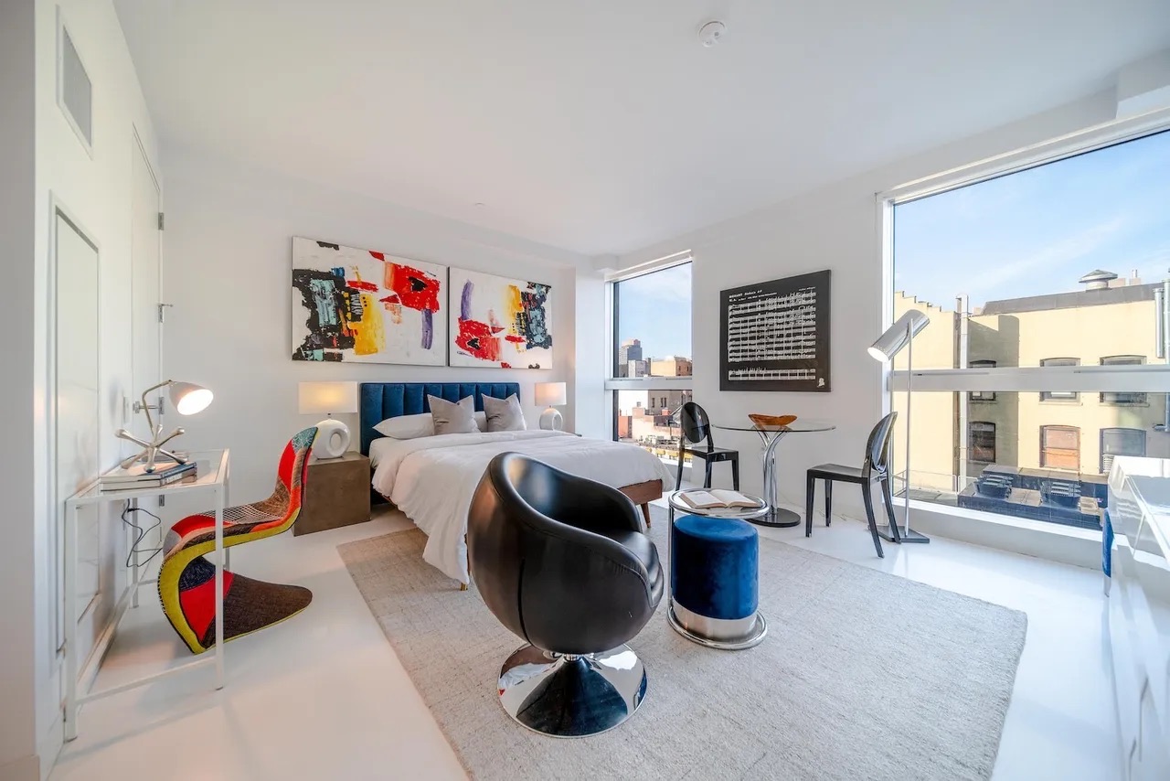 158 East 126th Street, Unit 730 Manhattan, NY 10035 - Photo 3 of 18 a room with lots of stuff and furniture