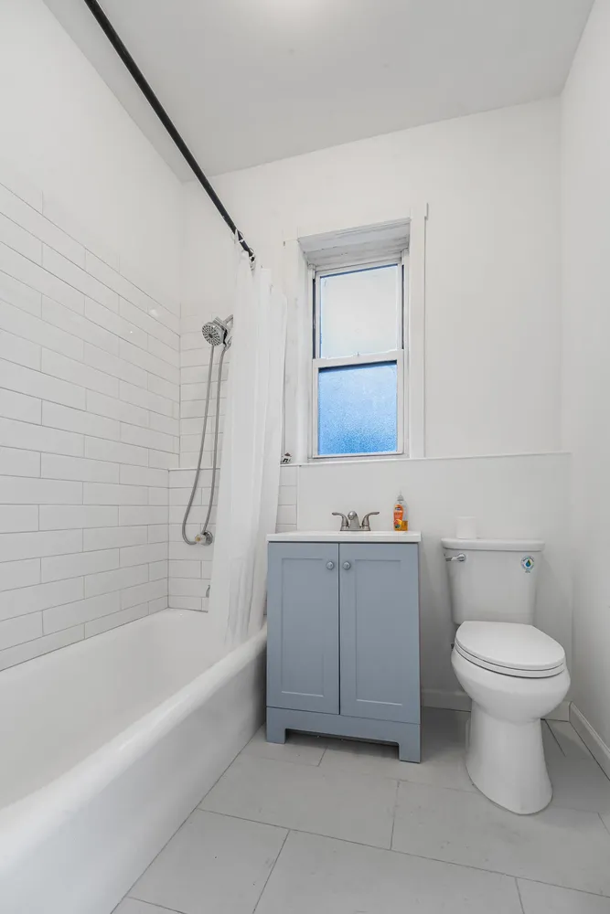 a bathroom with a sink a toilet and bathtub