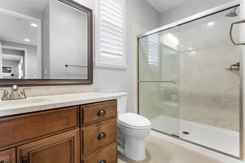 a spacious bedroom with a bed and a couch