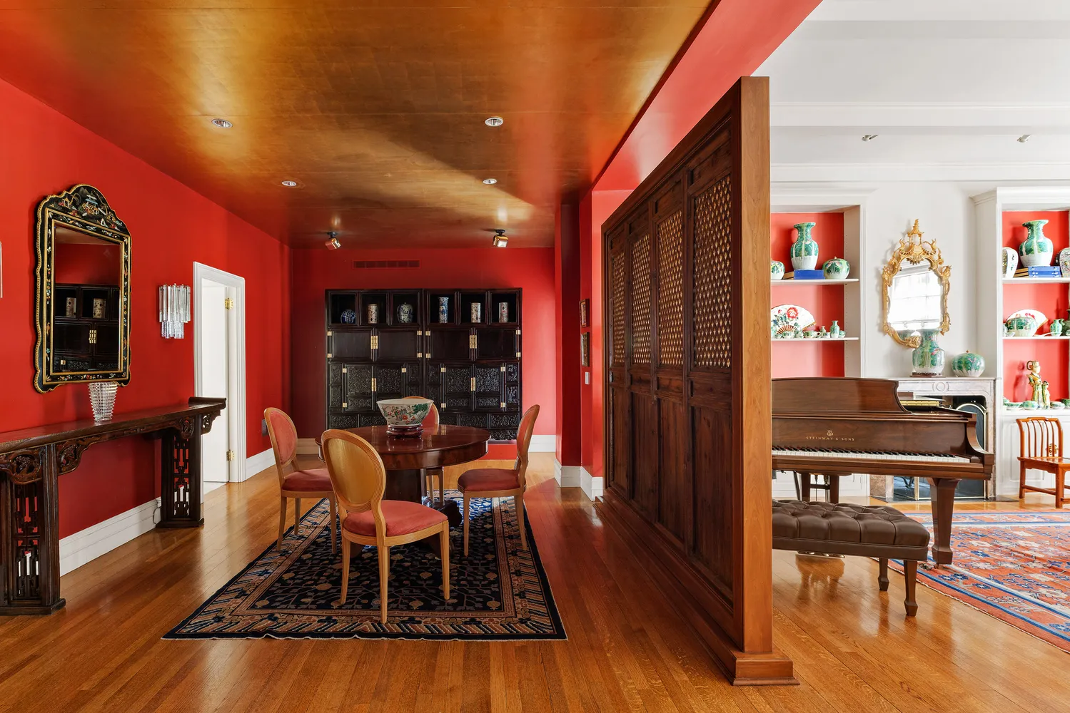 a dining room with furniture and wooden floor