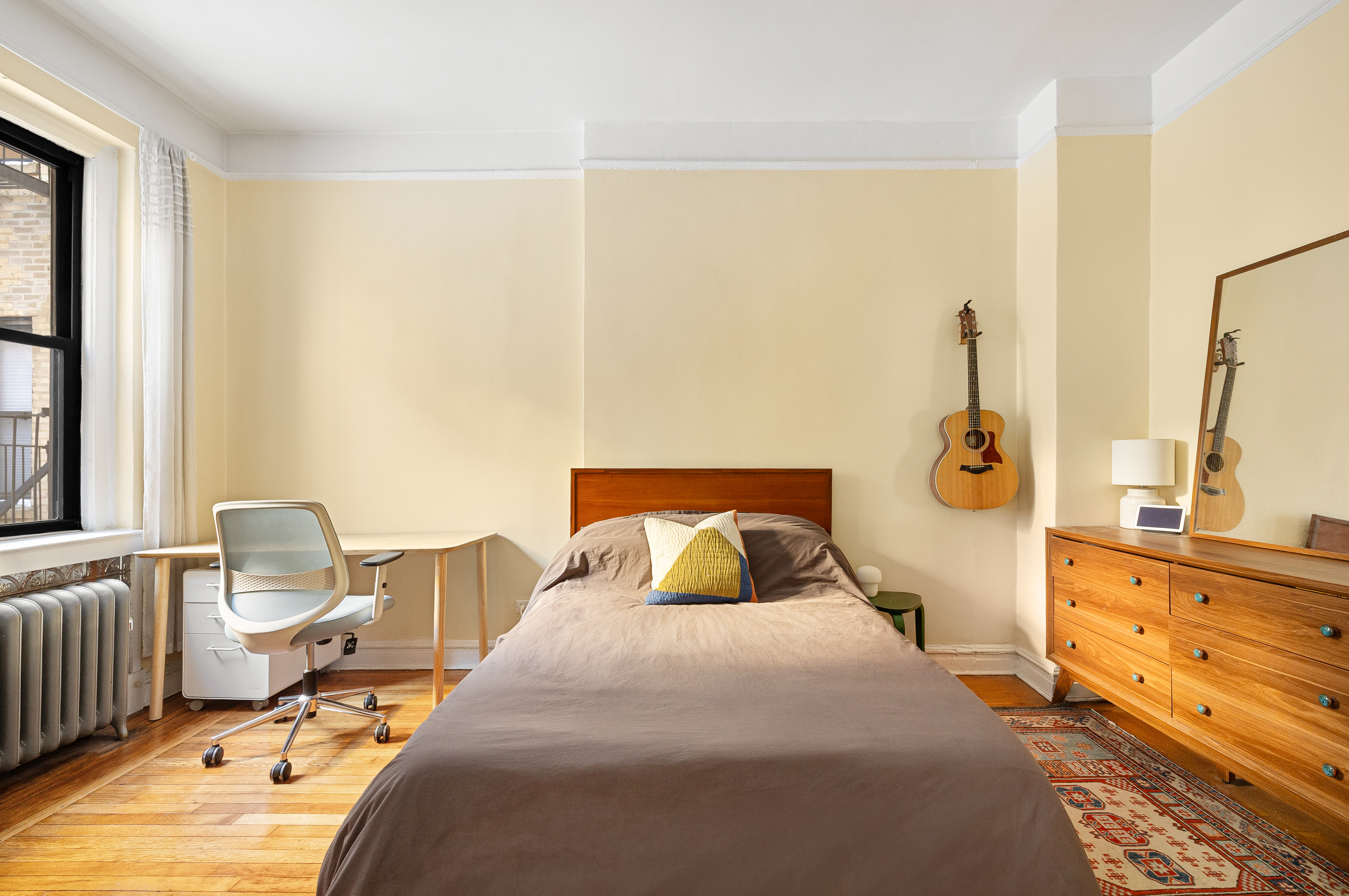 78 8th Avenue, Unit 2K Brooklyn, NY 11215 - Photo 6 of 10 a bedroom with a bed and wooden floor