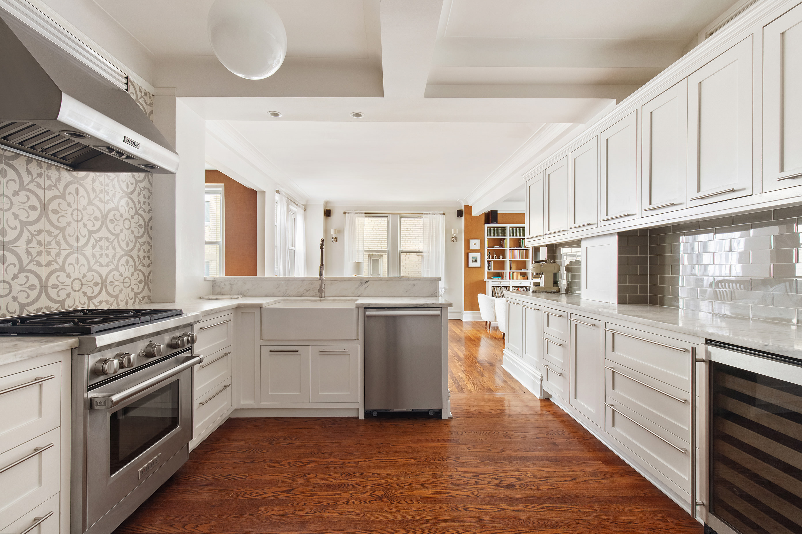 136 East 36th Street, Unit 9/10C Manhattan, NY 10016 - Photo 3 of 16 a kitchen with a stove top oven and cabinets