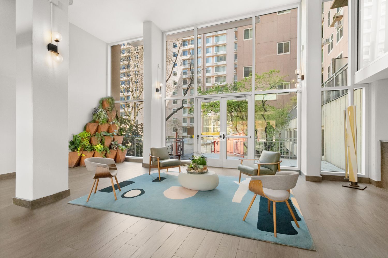 575 Main Street, Unit 509 Manhattan, NY 10044 - Photo 13 of 25 a living room with furniture and a large window