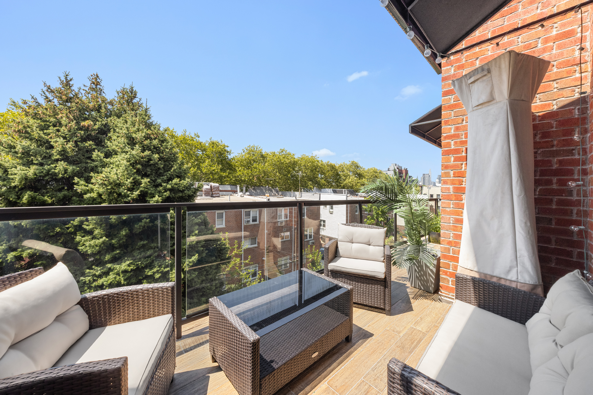 43 Newel Street, Unit PH2 Brooklyn, NY 11222 - Photo 3 of 10 a view of a chair and couches in the deck