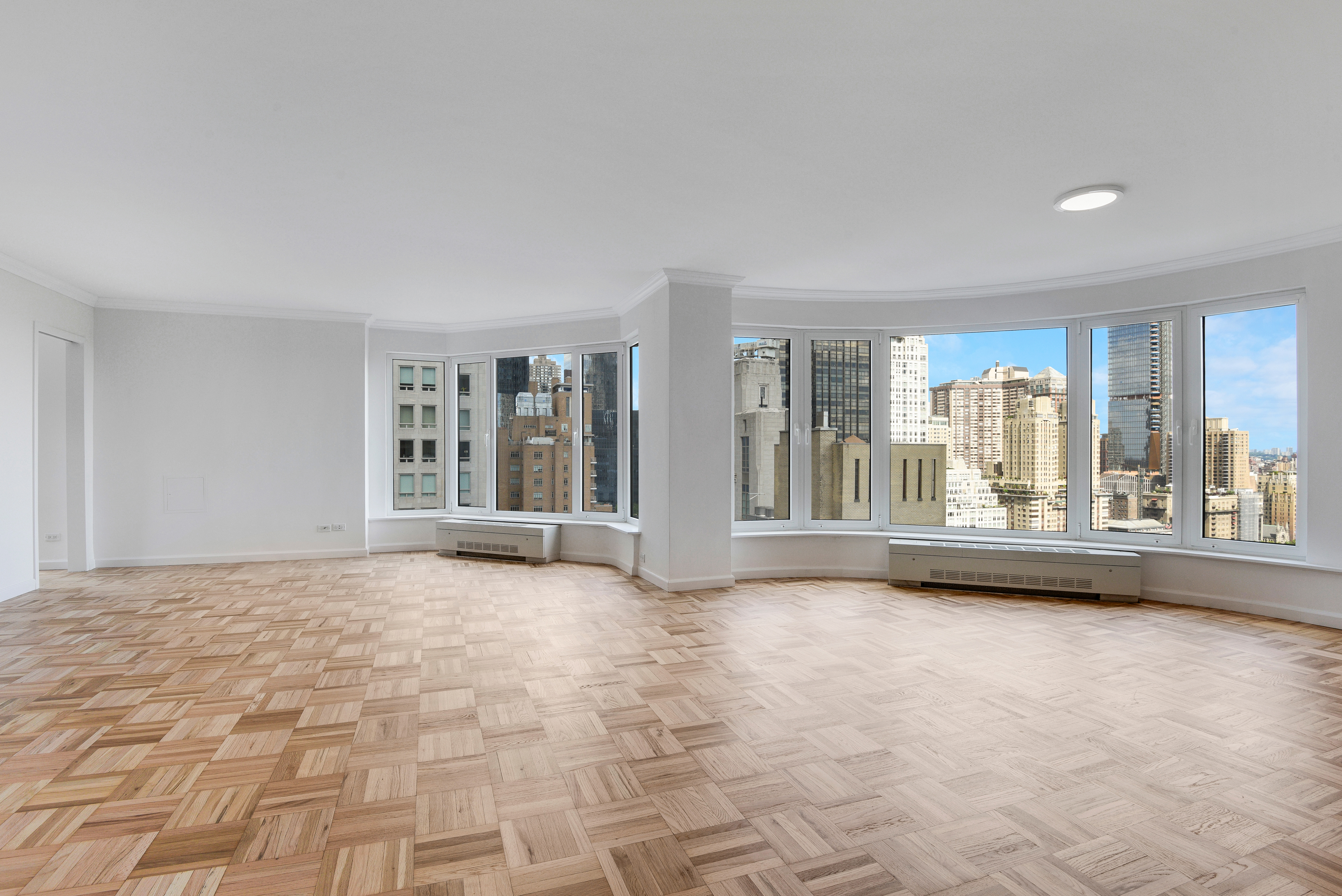 200 Central Park South, Unit 29C Manhattan, NY 10019 - Photo 11 of 23 a view of an empty room with window