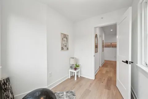 a view of a bedroom from a hallway