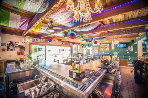 a bedroom with two beds and a window