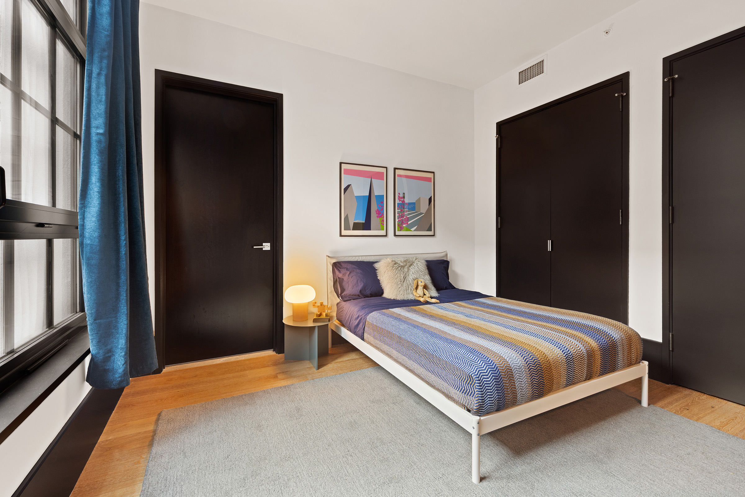 51 Jay Street, Unit 5J Brooklyn, NY 11201 - Photo 11 of 23 a bedroom with a bed and a painting on the wall