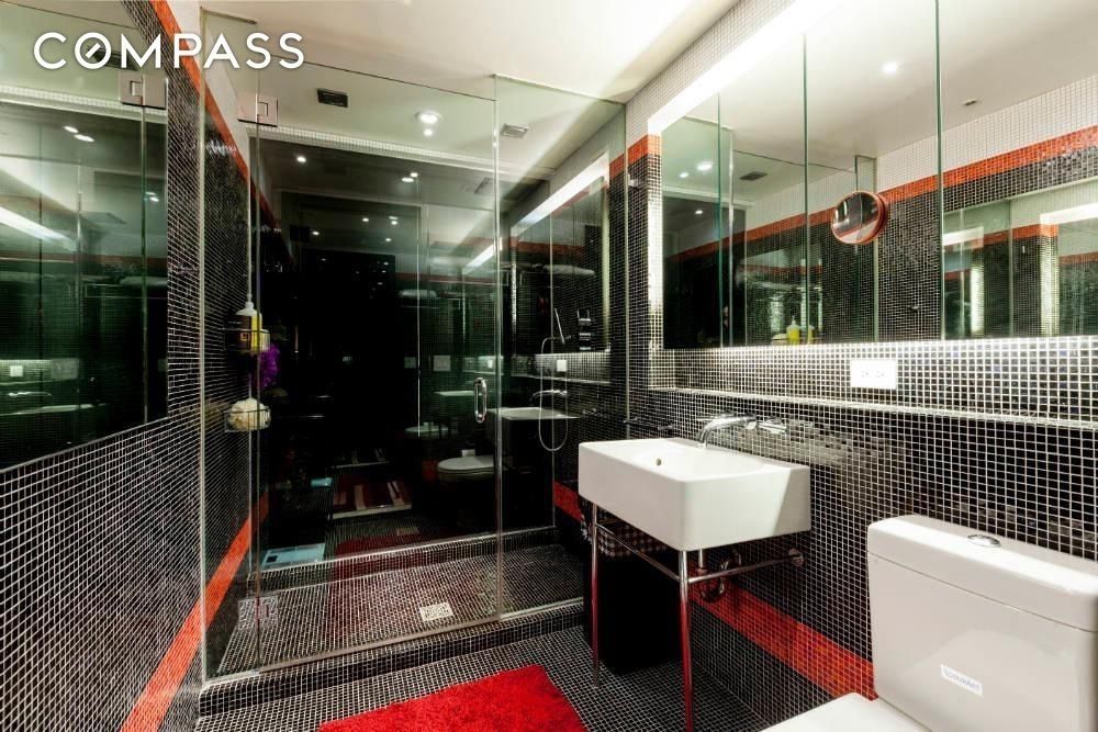 16 West 19th Street, Unit 10E Manhattan, NY 10011 - Photo 6 of 10 a bathroom with a sink a toilet a mirror and shower