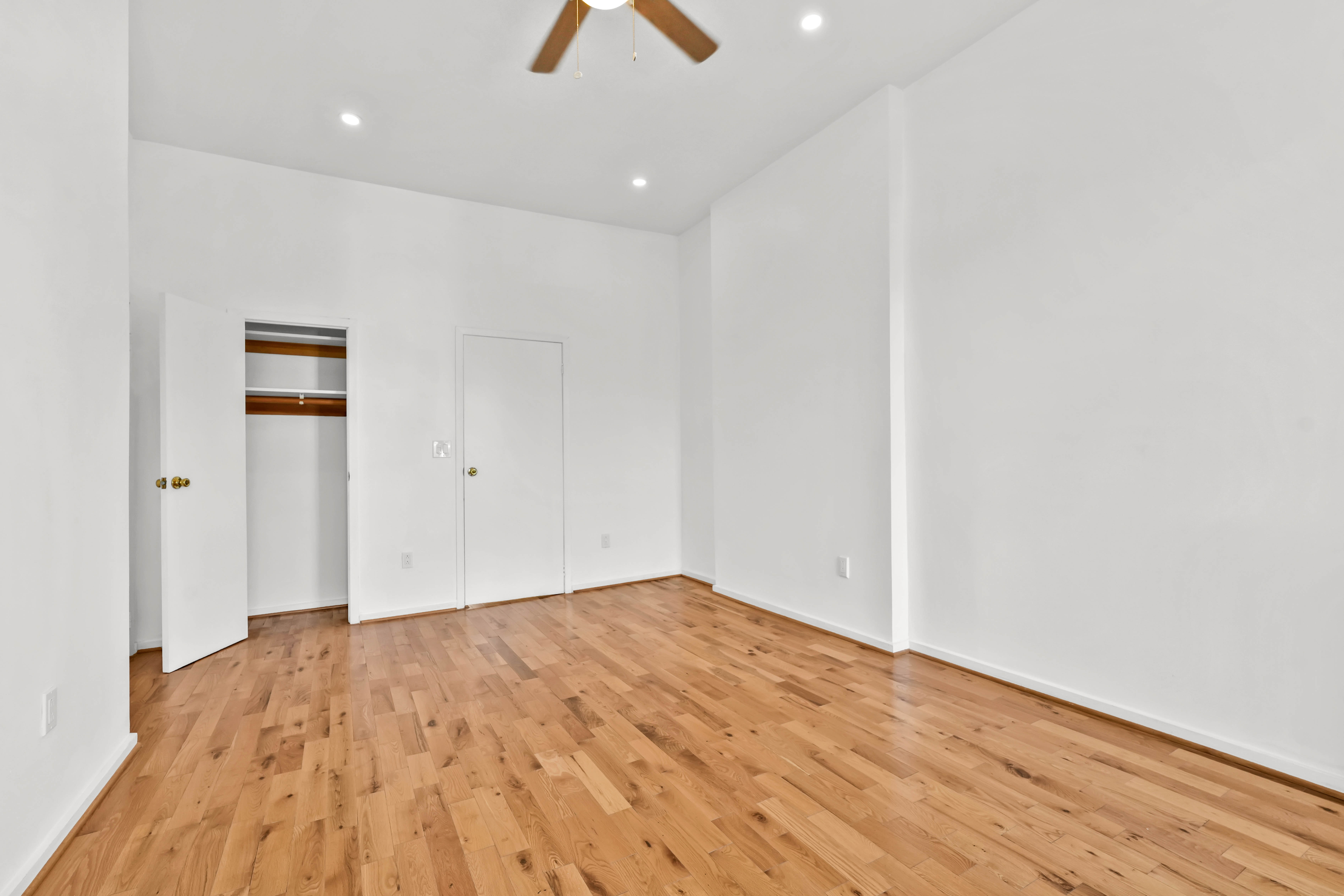 238 Vernon Avenue, Unit 2 Brooklyn, NY 11206 - Photo 5 of 21 a view of empty room with wooden floor