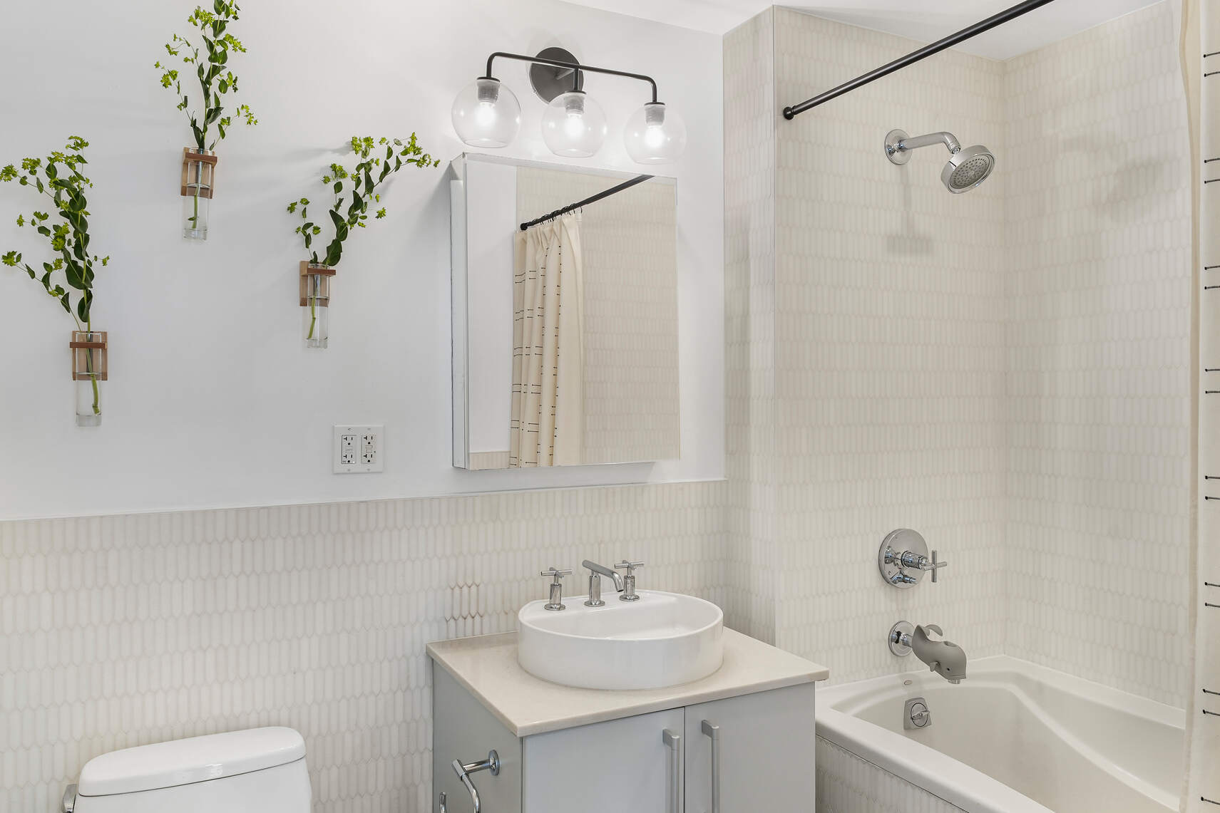 199 State Street, Unit 5C Brooklyn, NY 11201 - Photo 11 of 16 a bathroom with a sink a toilet and shower