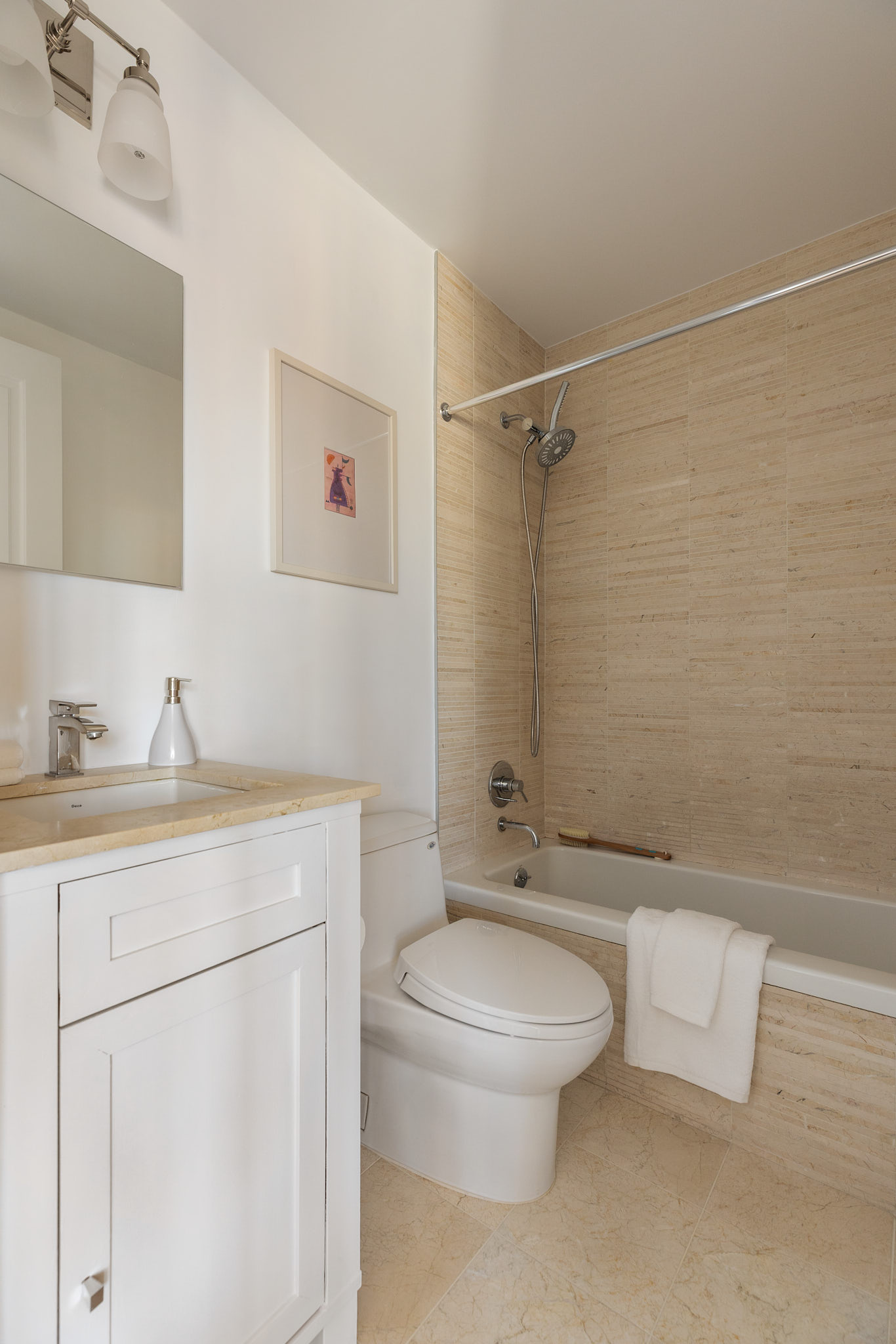 1438 3rd Avenue, Unit 15B Manhattan, NY 10028 - Photo 9 of 21 a bathroom with a sink a toilet and shower