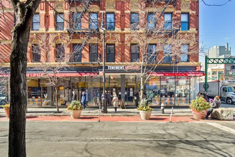 a front view of a building with many windows