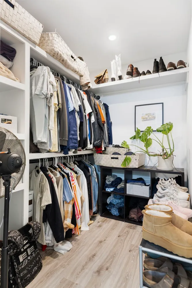 a view of living room filled with furniture and a potted plant