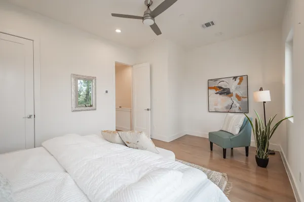 a bathroom with a double vanity sink mirror and shower