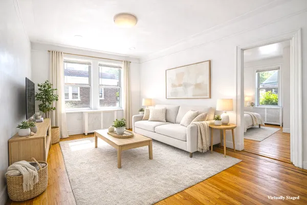 a living room with furniture and a large window