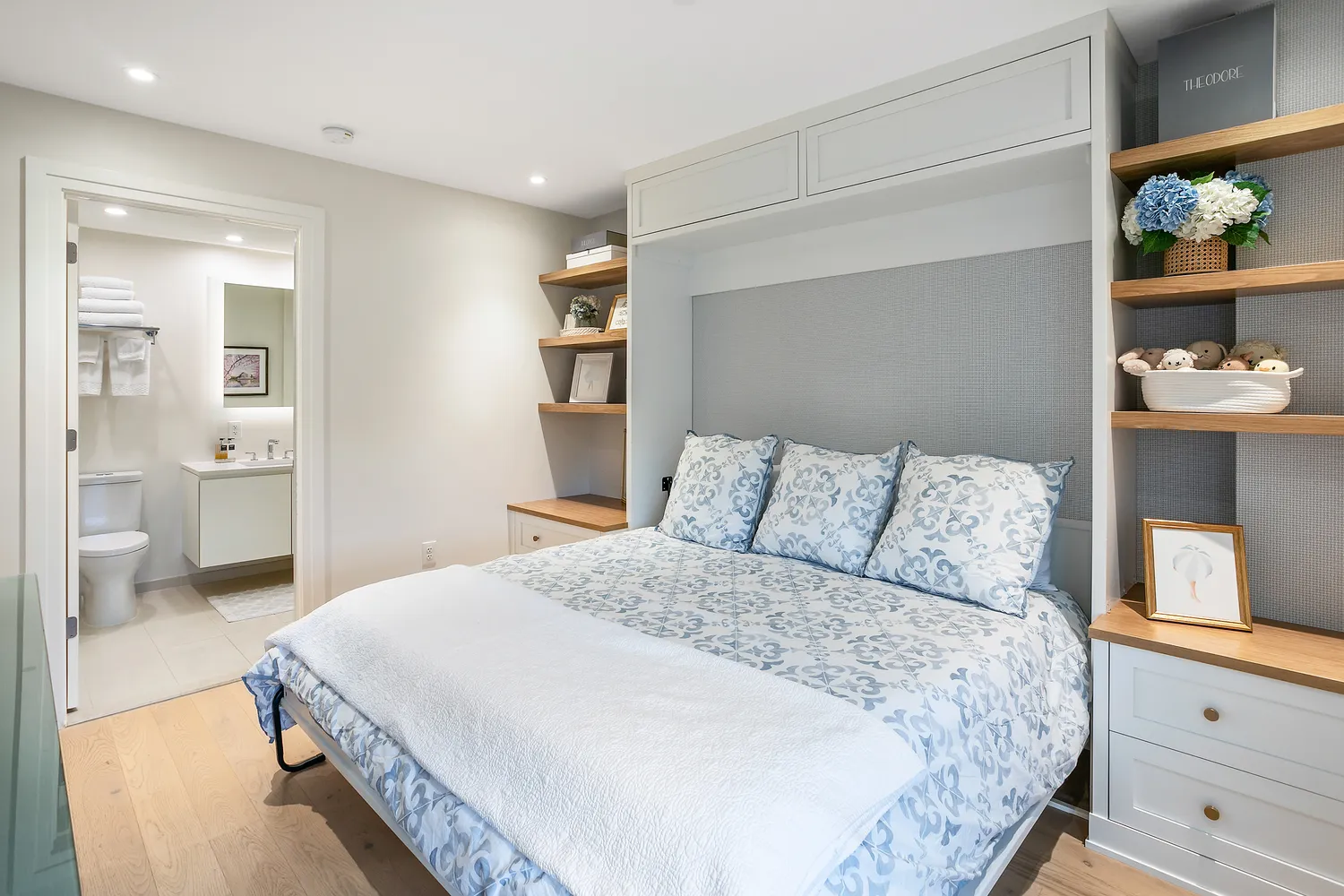 a bathroom with a sink toilet vanity and shower