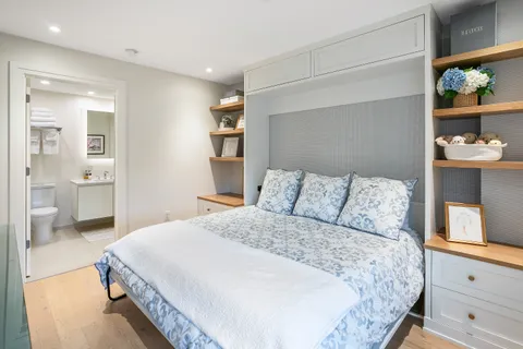 a bathroom with a sink toilet vanity and shower