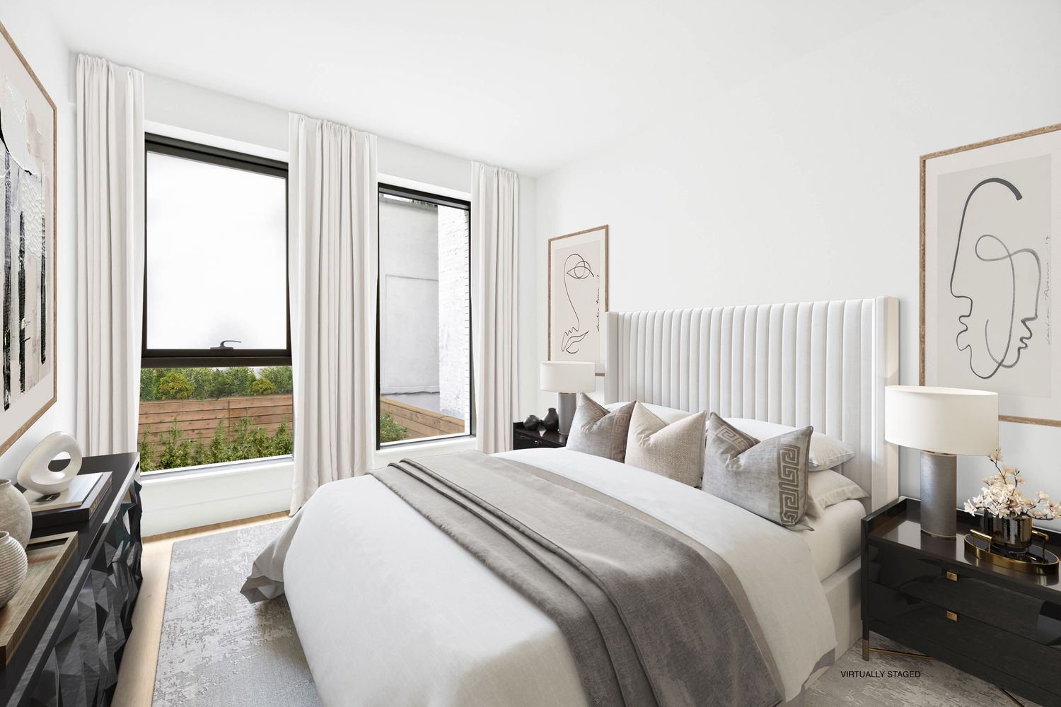 a bedroom with a large bed and a lamp next to a window