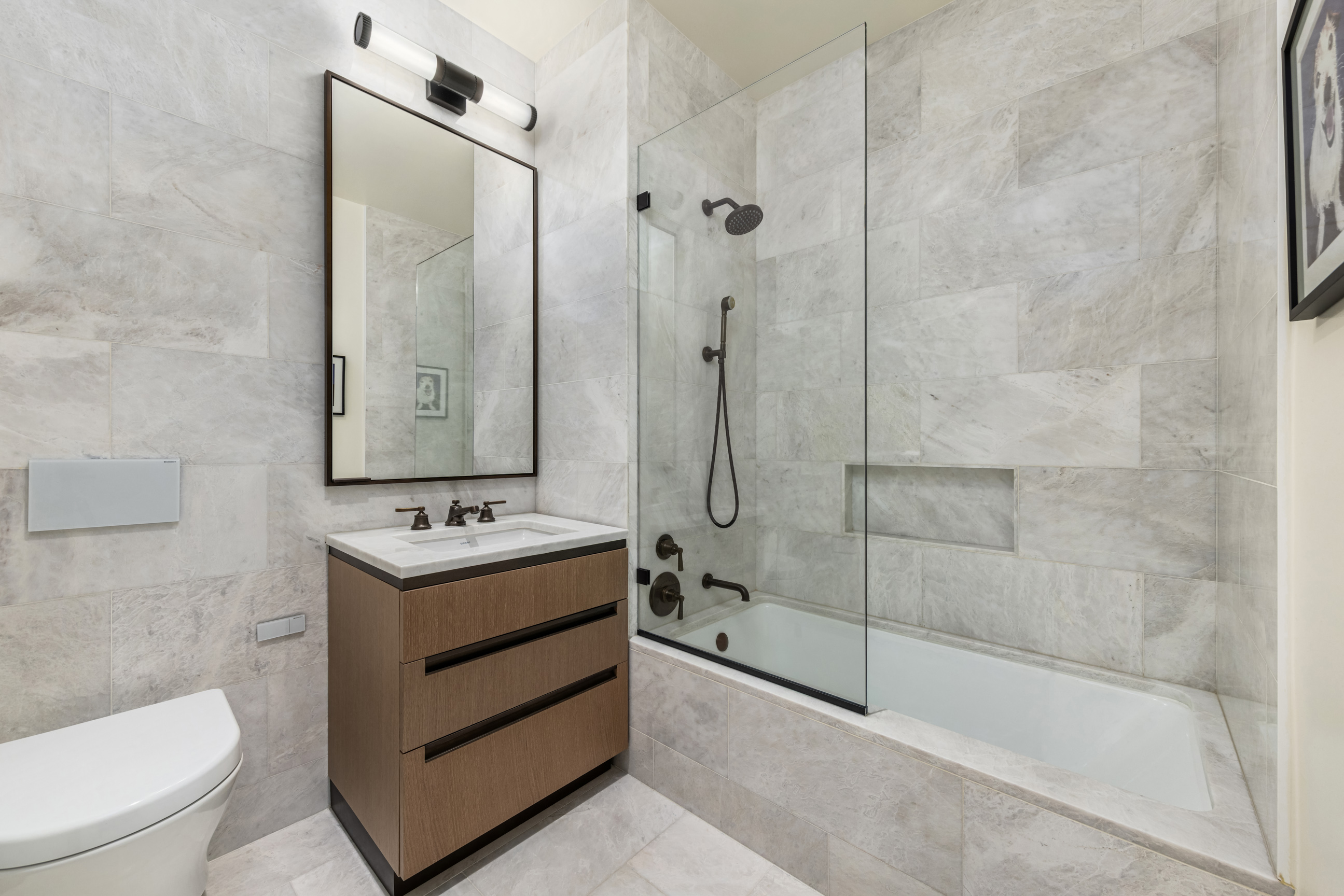 515 West 18th Street, Unit 1102 Manhattan, NY 10011 - Photo 15 of 18 a bathroom with a toilet sink and shower