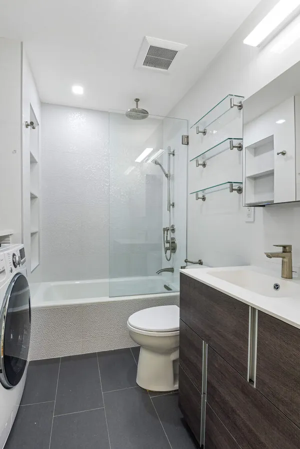 a bathroom with a sink a toilet and a bathtub
