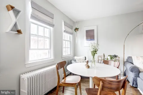 a workspace with a couch and a window