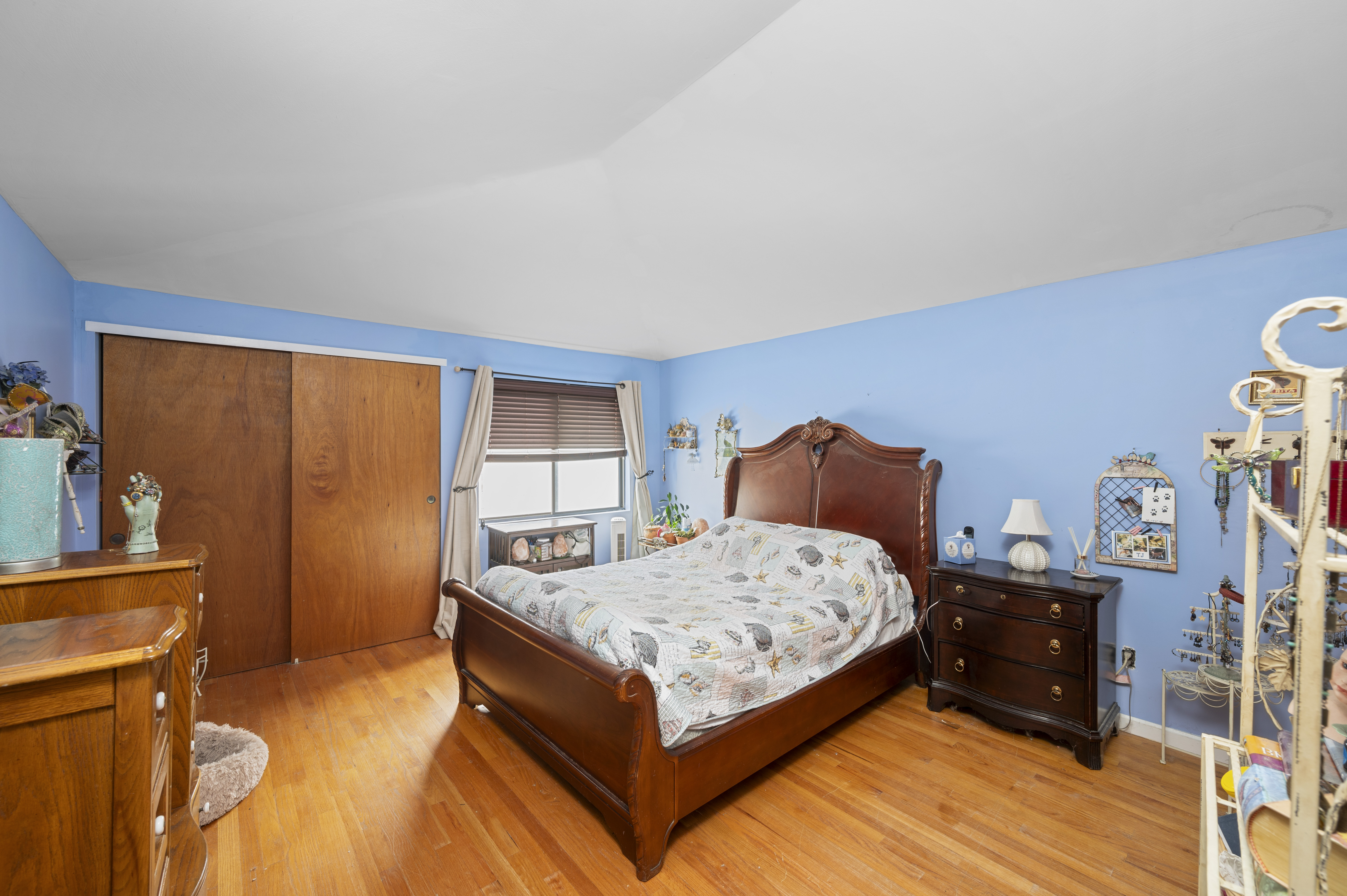 20 Eric Lane Staten Island, NY 10308 - Photo 12 of 20 a bedroom with a bed and wooden floor