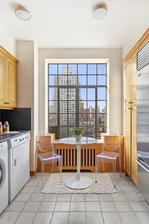 a view of a room that has a couch and a table in it