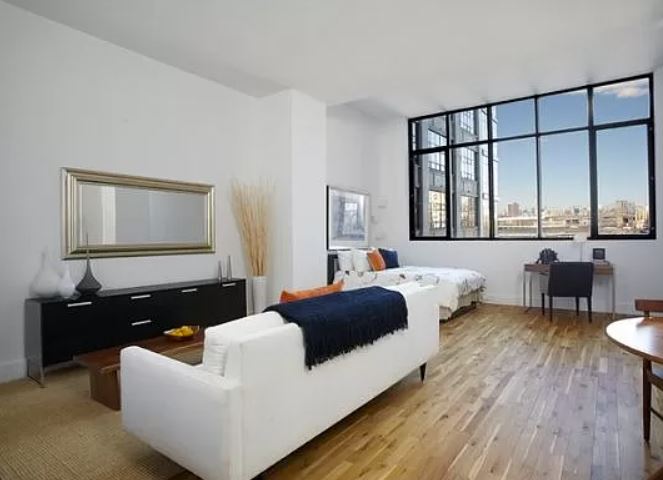 360 Furman Street, Unit 723 Brooklyn, NY 11201 - Photo 2 of 41 a living room with furniture and a large window