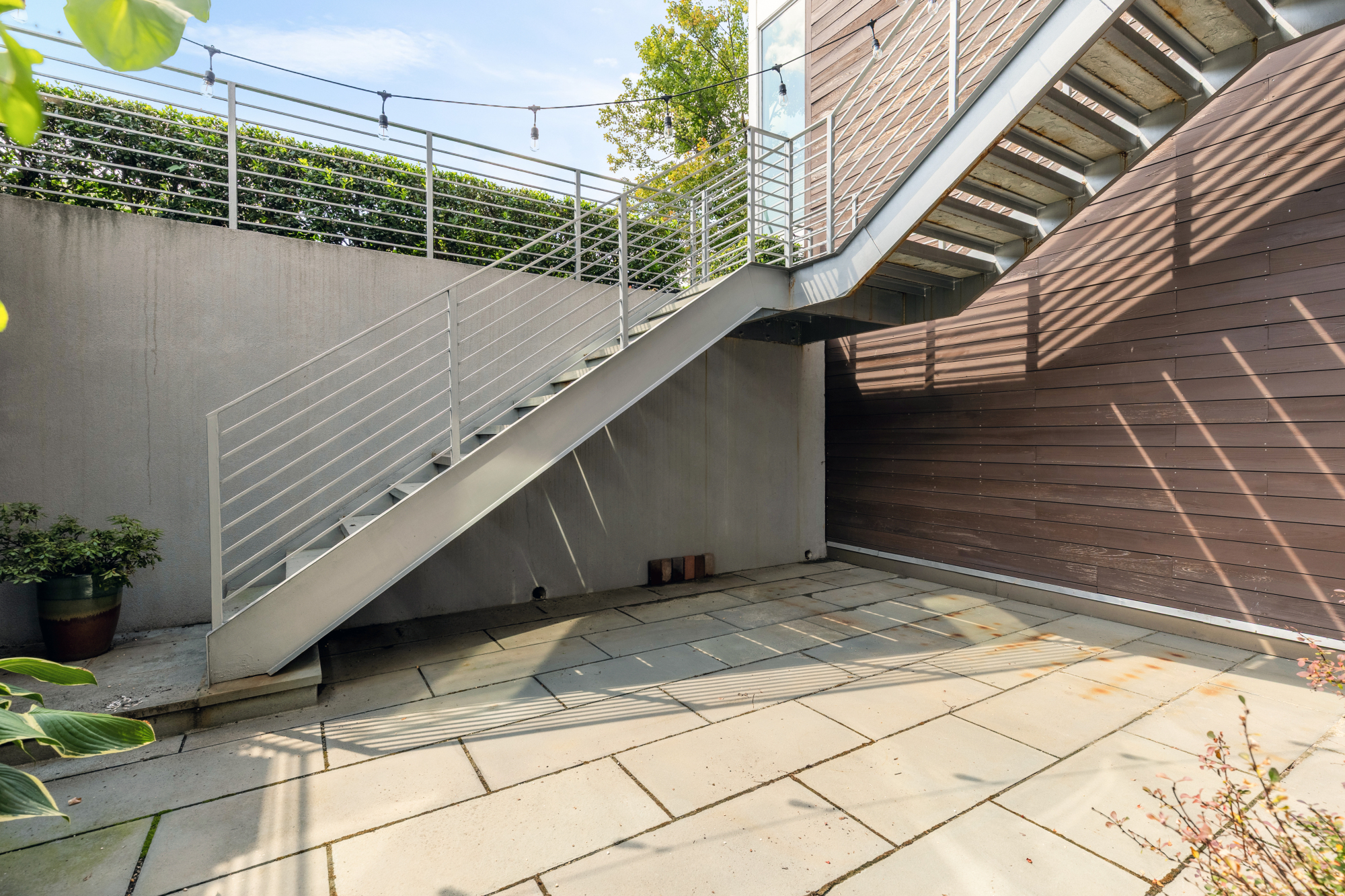1501 4th Street Northwest, Unit 1 Washington, DC 20001 - Photo 33 of 41 a view of a backyard with a chair and wooden floor