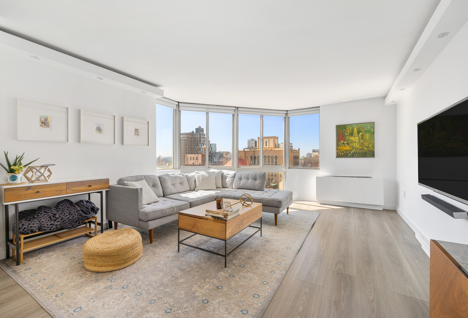 50 Lexington Avenue, Unit 25E Manhattan, NY 10010 - Photo 2 of 13 a living room with furniture and a flat screen tv