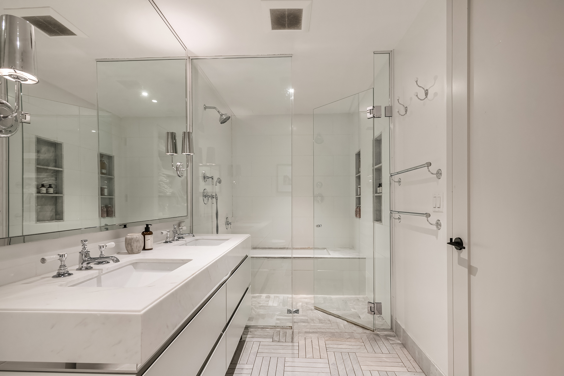 308 North 7th Street, Unit 2F Brooklyn, NY 11211 - Photo 7 of 17 a bathroom with a double vanity sink a toilet and shower