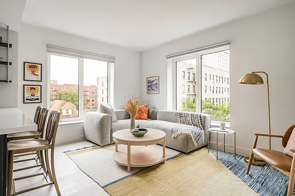 a living room with furniture and a window