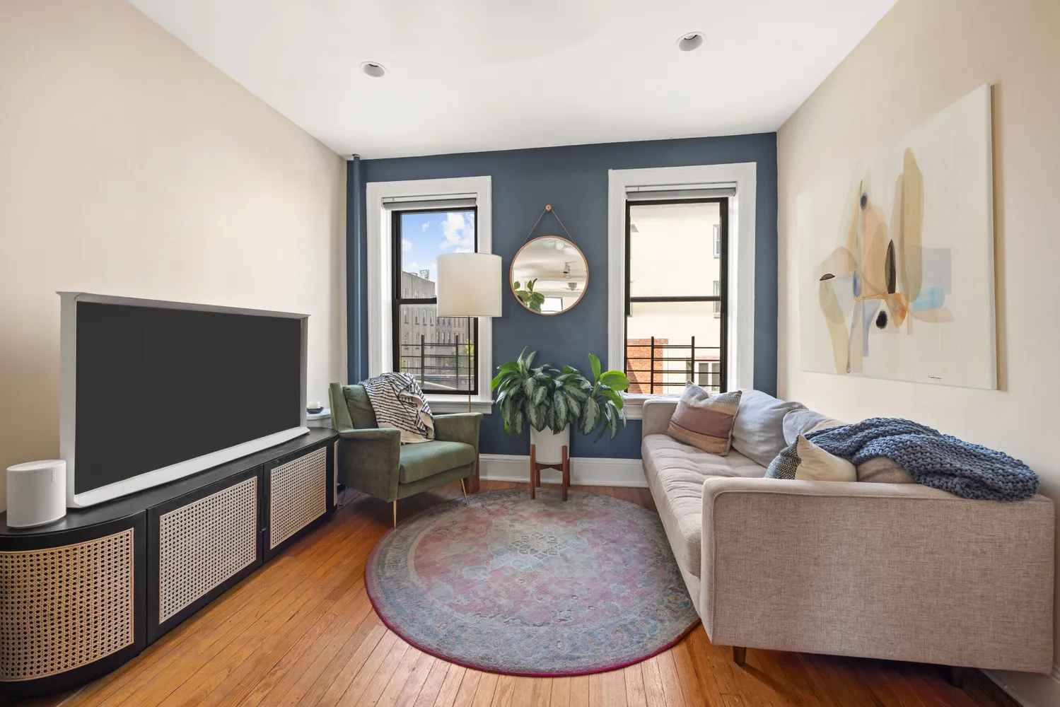 a view of living room with furniture and a potted plant