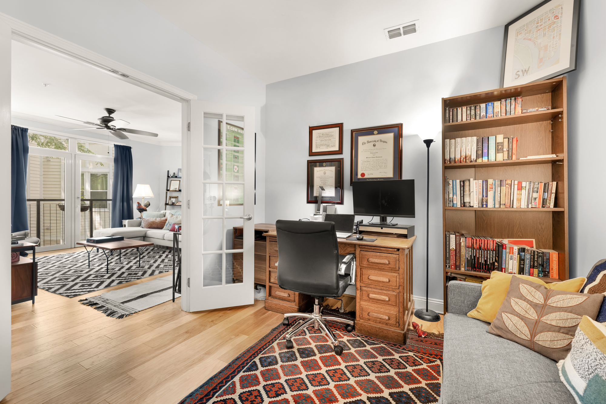 1391 Pennsylvania Ave. Southeast, Unit 324 Washington, DC 20003 - Photo 16 of 33 a living room with furniture and a flat screen tv