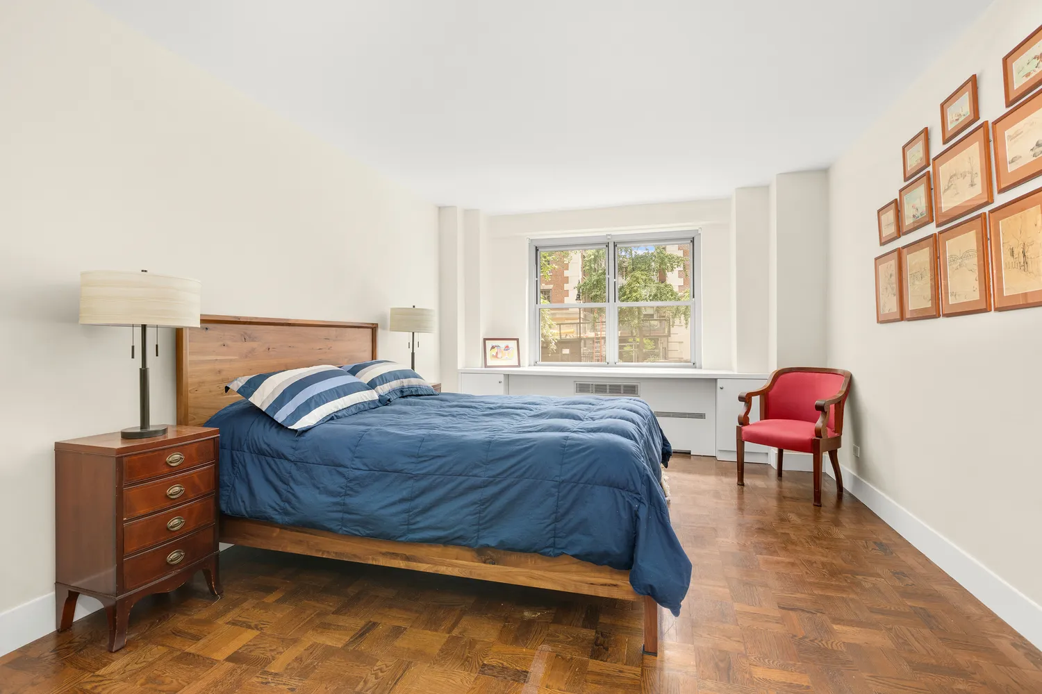 a bedroom with a bed and chair