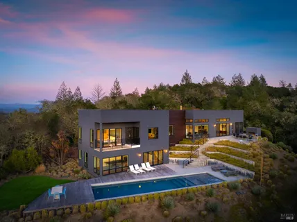 a view of a house with outdoor space and sitting area