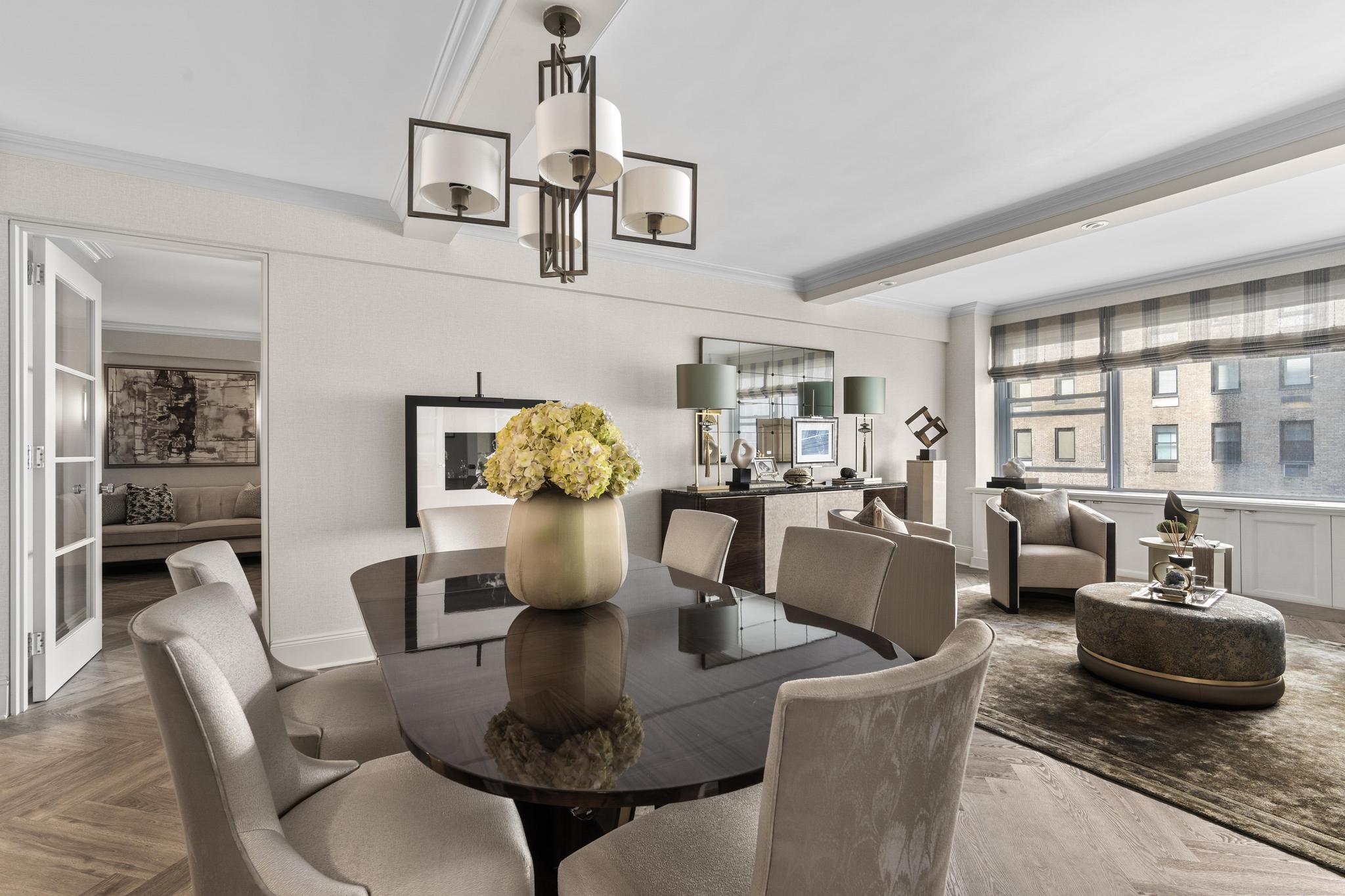 110 East 57th Street, Unit 10CD Manhattan, NY 10022 - Photo 2 of 16 a living room with furniture and a large window