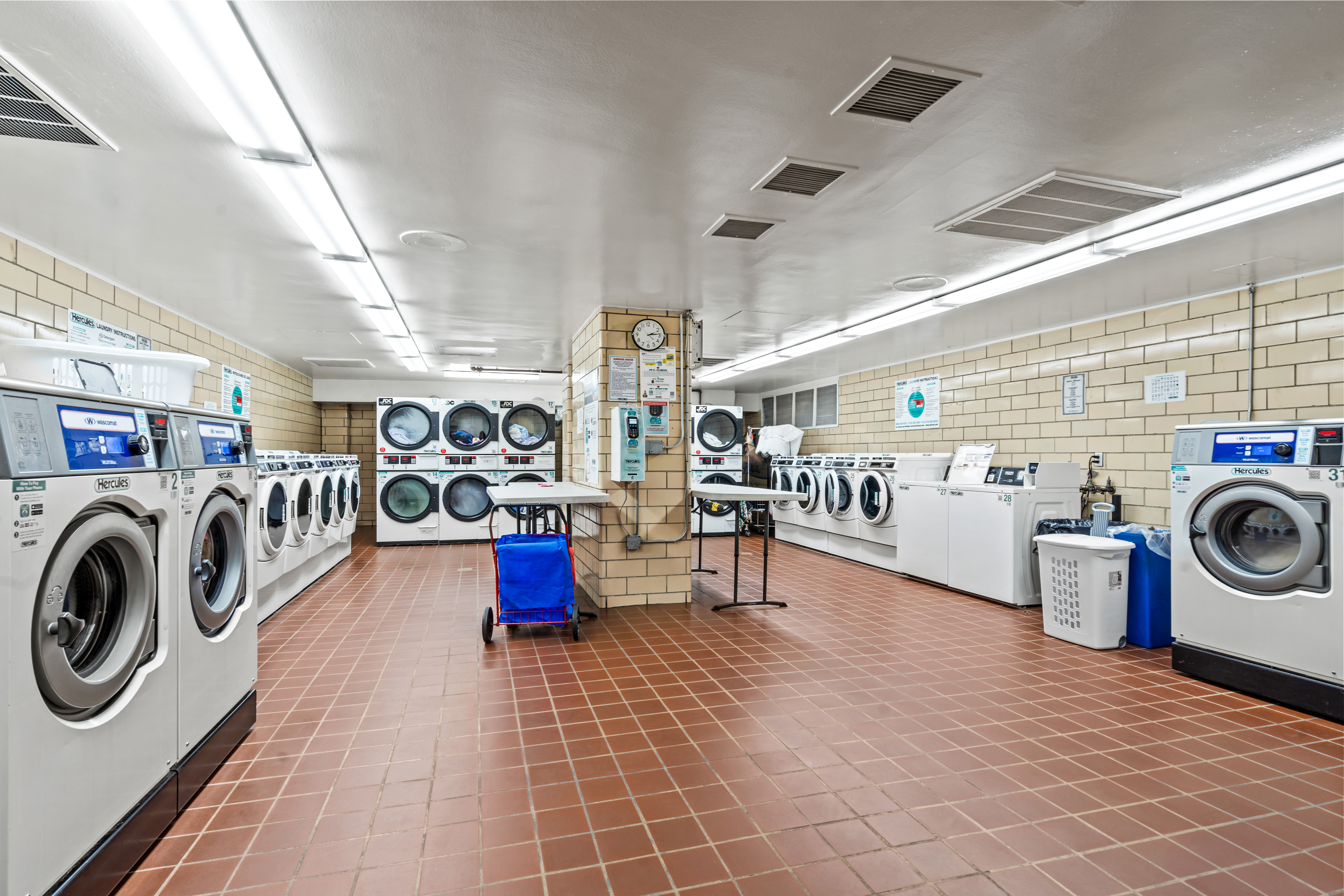 205 3rd Avenue, Unit 11T Manhattan, NY 10003 - Photo 18 of 20 a view of a storage and utility room with washer and dryer