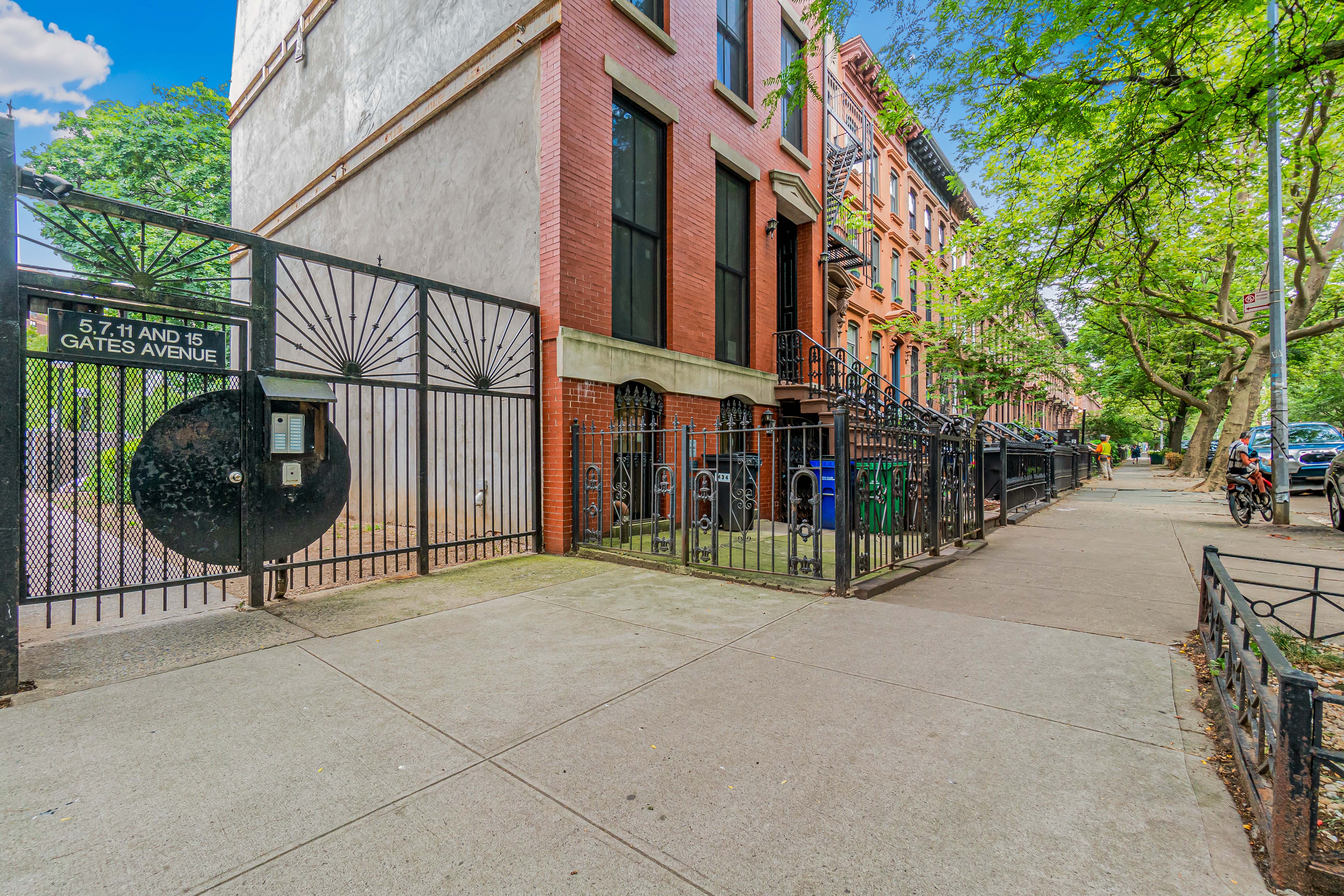 7 Gates Avenue, Unit H Brooklyn, NY 11238 - Photo 18 of 20 a view of a brick building with a yard