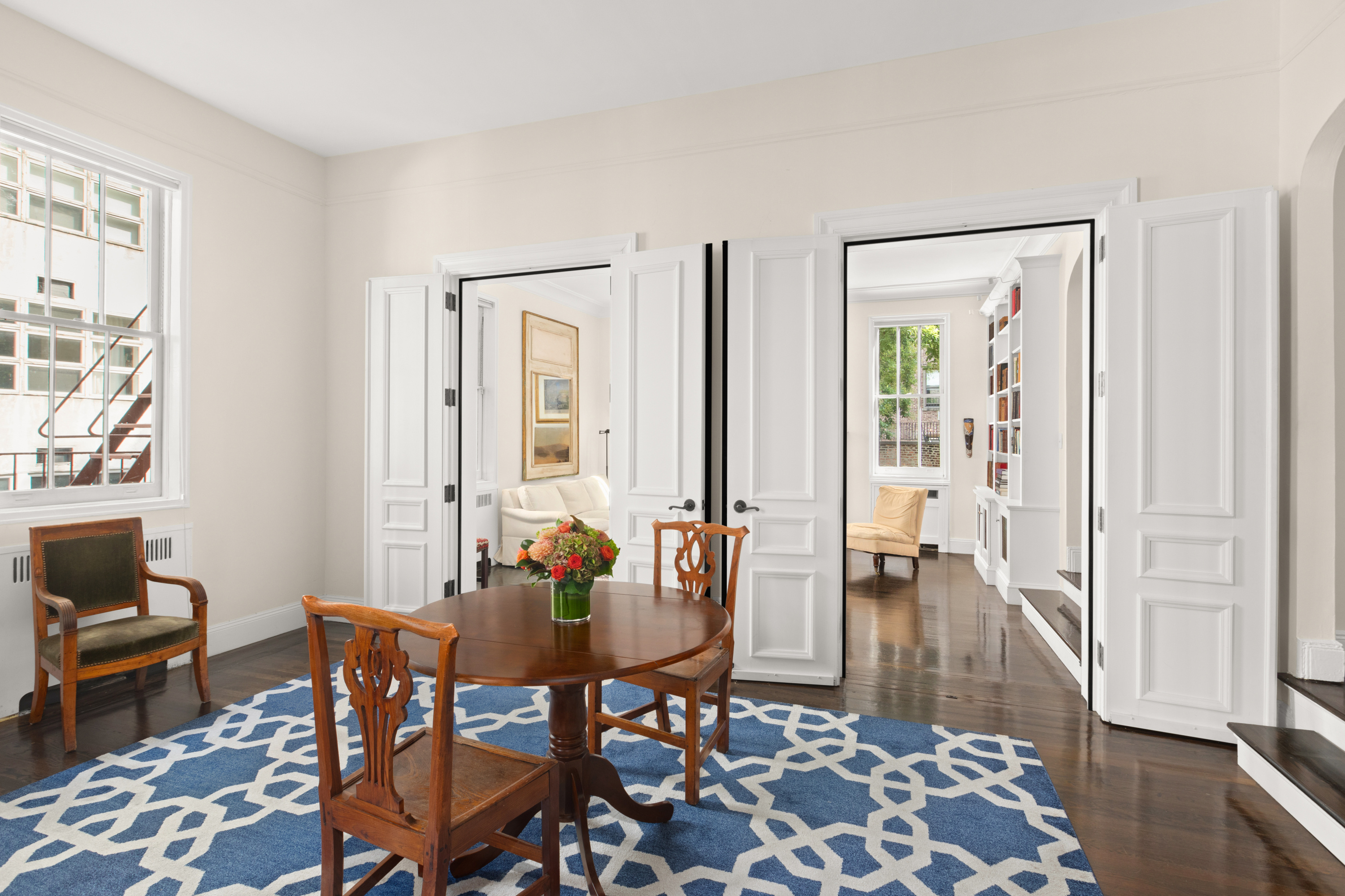51 East 78th Street, Unit 3BC Manhattan, NY 10075 - Photo 5 of 25 a dining room with furniture and wooden floor