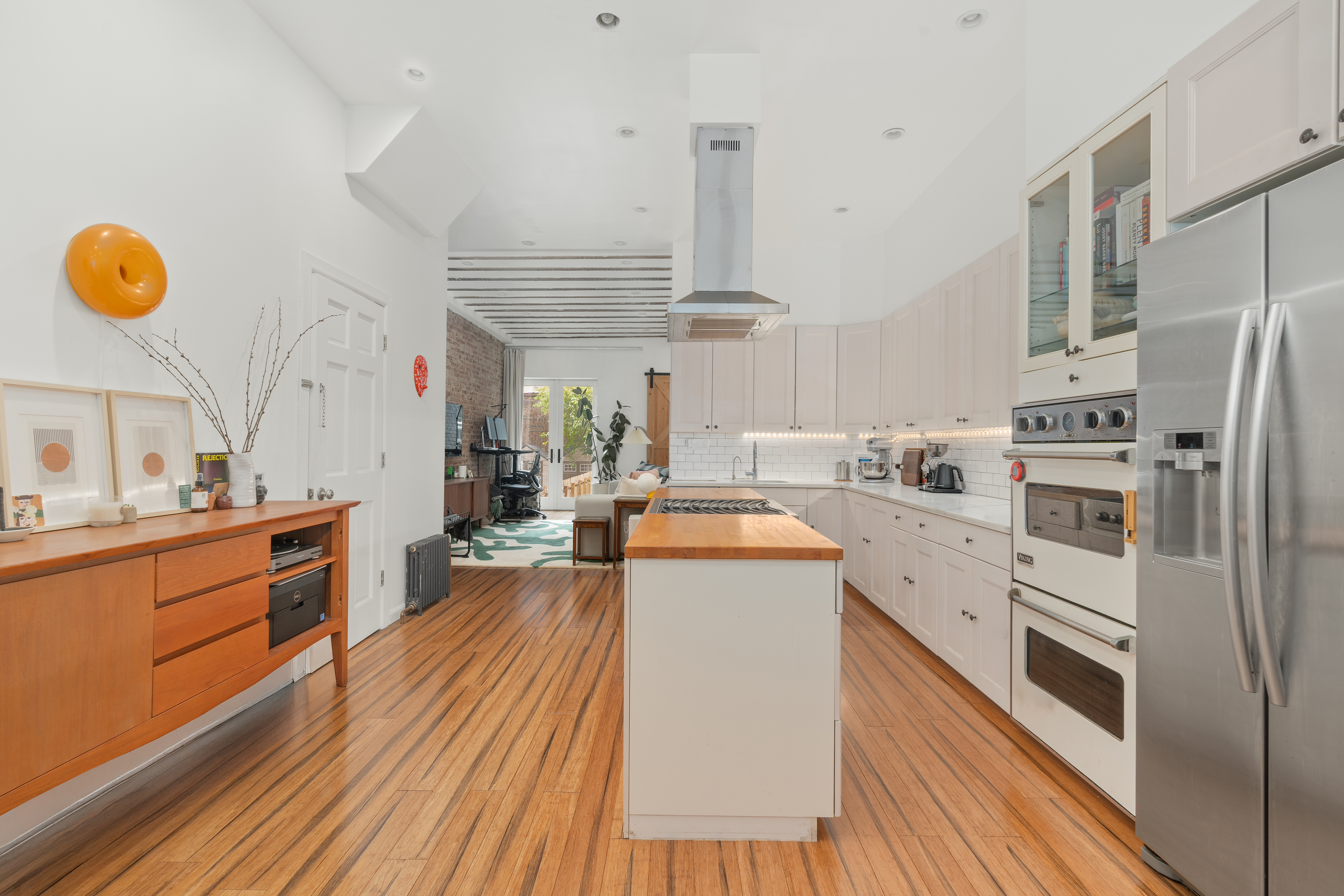 660 Saint Marks Avenue Brooklyn, NY 11216 - Photo 14 of 21 a kitchen that has a lot of cabinets a sink and appliances