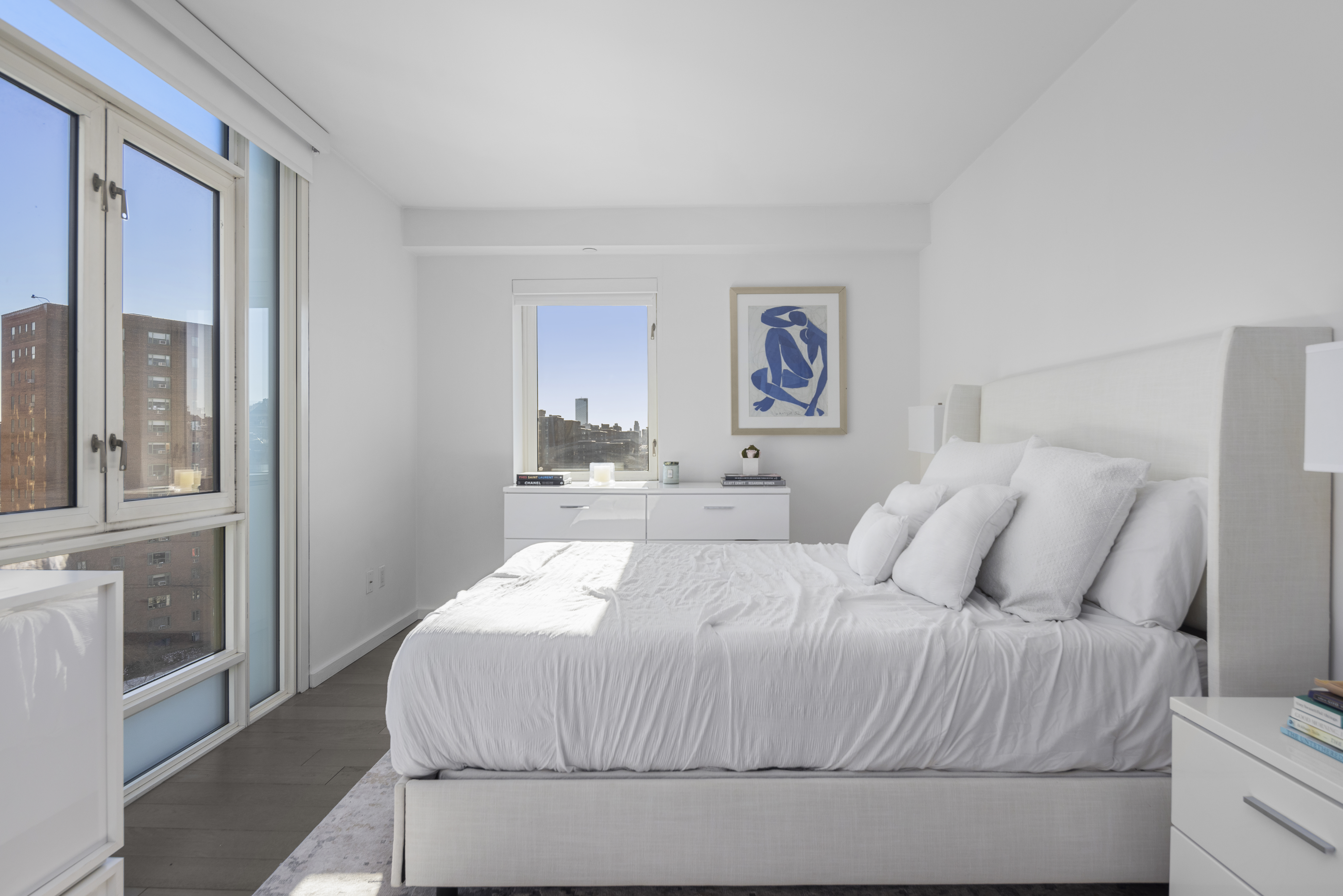 385 1st Avenue, Unit 10G Manhattan, NY 10010 - Photo 7 of 22 a bed sitting in a bedroom next to a window